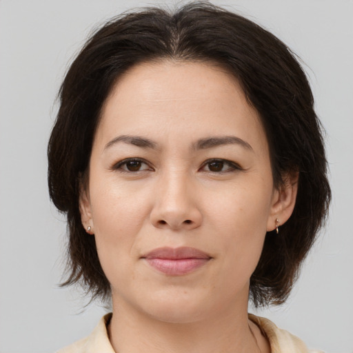 Joyful white young-adult female with medium  brown hair and brown eyes