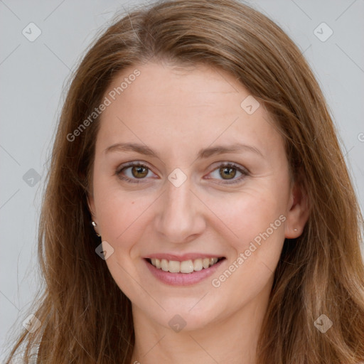 Joyful white young-adult female with long  brown hair and green eyes