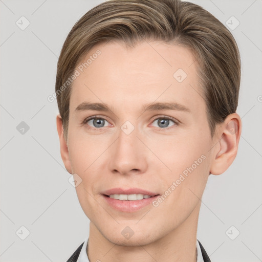 Joyful white young-adult male with short  brown hair and grey eyes