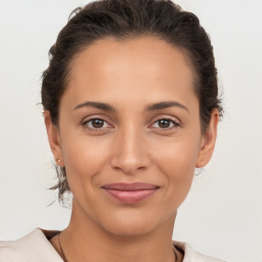 Joyful white young-adult female with short  brown hair and brown eyes