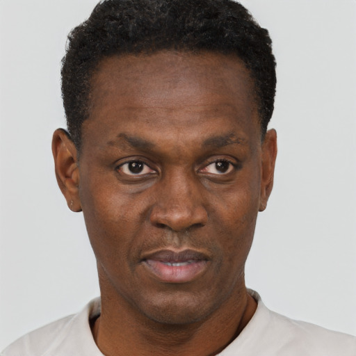 Neutral black adult male with short  black hair and brown eyes