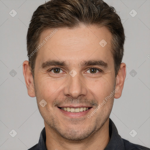 Joyful white adult male with short  brown hair and brown eyes