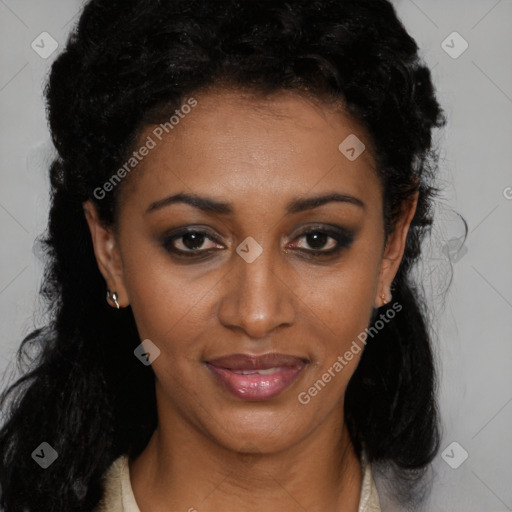 Joyful black young-adult female with long  black hair and brown eyes