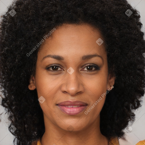 Joyful black adult female with medium  brown hair and brown eyes