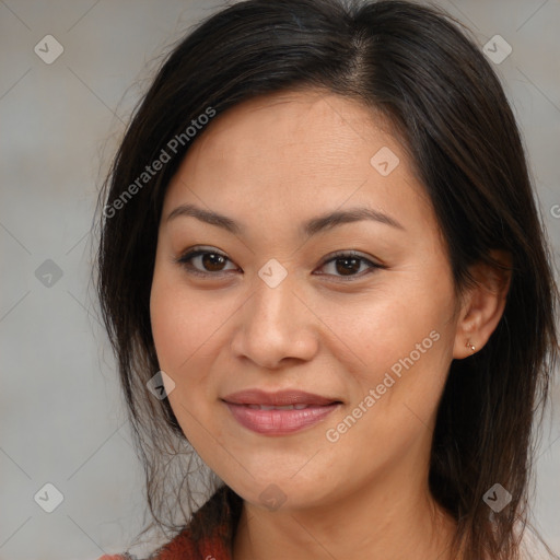 Joyful latino young-adult female with medium  brown hair and brown eyes