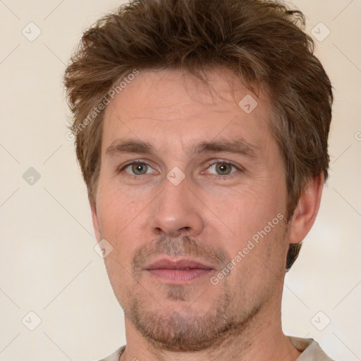 Neutral white adult male with short  brown hair and grey eyes