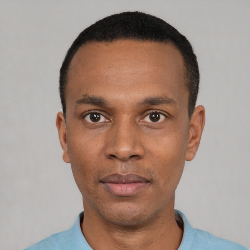 Neutral black young-adult male with short  black hair and brown eyes