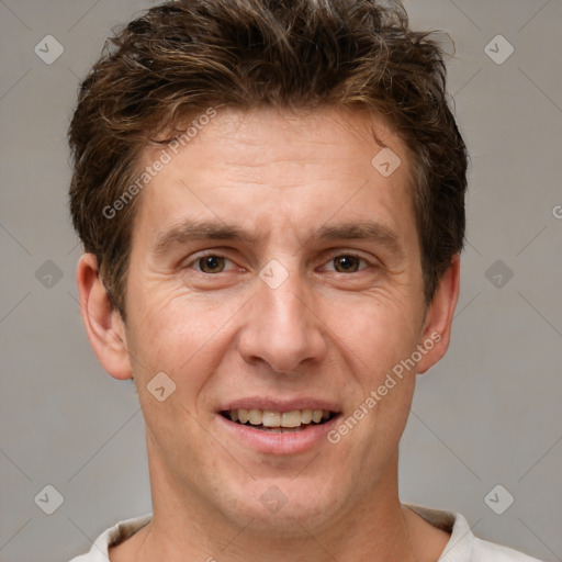 Joyful white adult male with short  brown hair and brown eyes