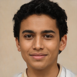 Joyful latino young-adult male with short  brown hair and brown eyes