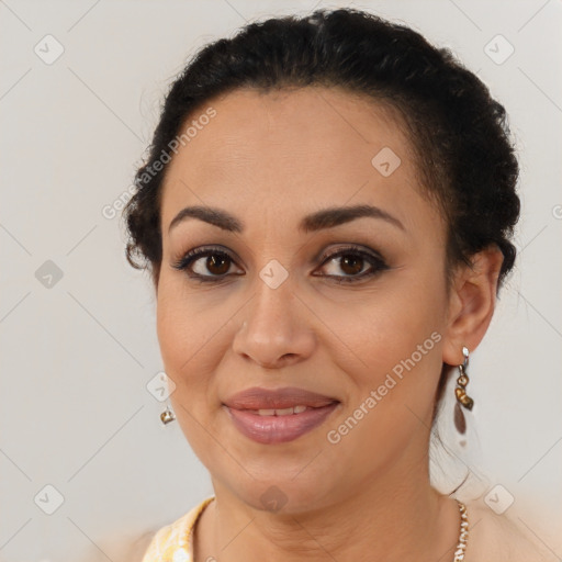 Joyful latino young-adult female with short  brown hair and brown eyes