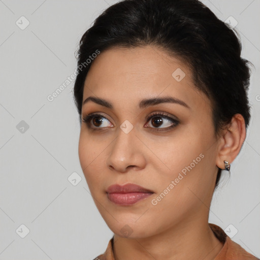 Joyful latino young-adult female with short  brown hair and brown eyes