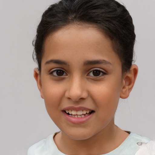 Joyful white child female with short  brown hair and brown eyes