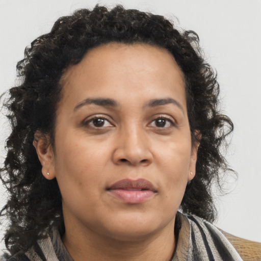 Neutral latino adult female with medium  brown hair and brown eyes