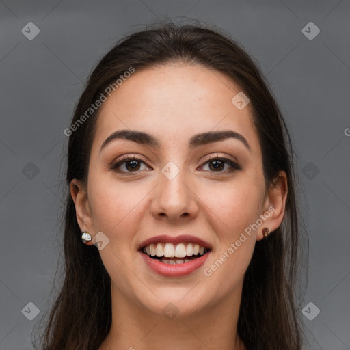 Joyful white young-adult female with long  brown hair and brown eyes