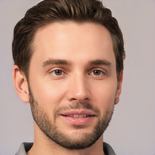 Joyful white young-adult male with short  brown hair and brown eyes