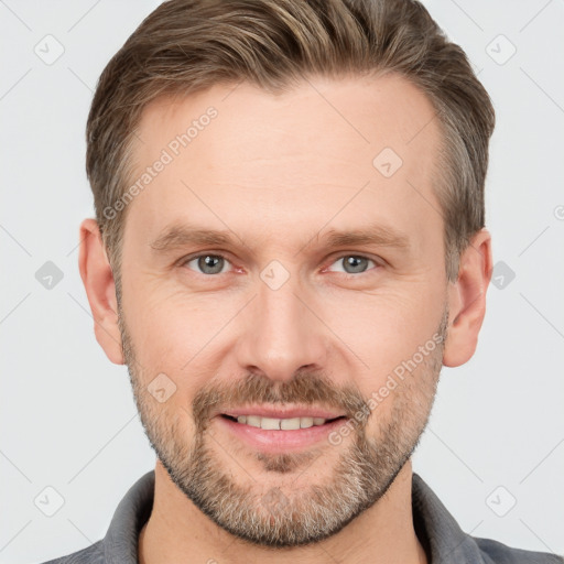 Joyful white adult male with short  brown hair and grey eyes