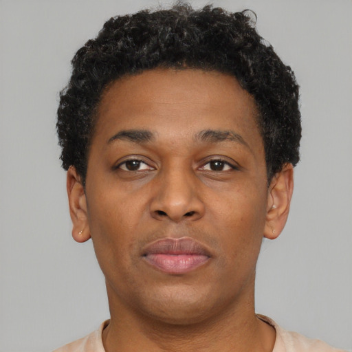 Neutral latino young-adult male with short  brown hair and brown eyes