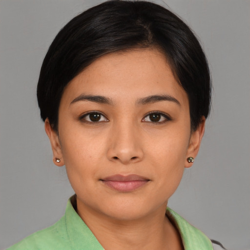 Joyful asian young-adult female with short  black hair and brown eyes