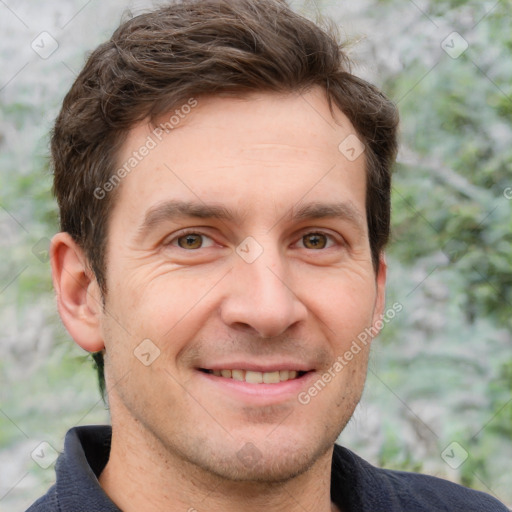 Joyful white adult male with short  brown hair and grey eyes