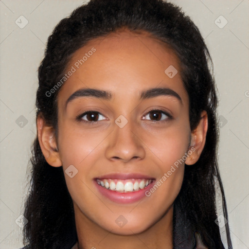 Joyful latino young-adult female with long  brown hair and brown eyes