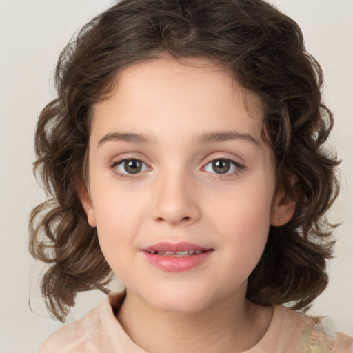 Joyful white child female with medium  brown hair and brown eyes