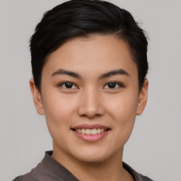 Joyful asian young-adult female with short  brown hair and brown eyes