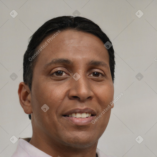 Joyful black young-adult male with short  brown hair and brown eyes