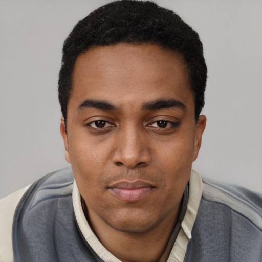 Neutral black young-adult male with short  black hair and brown eyes