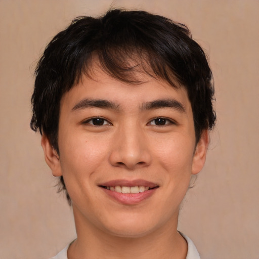 Joyful asian young-adult male with medium  brown hair and brown eyes