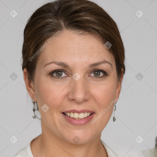 Joyful white adult female with short  brown hair and grey eyes