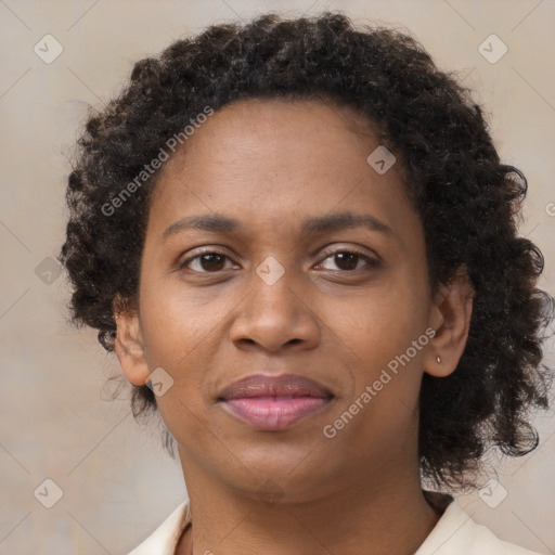 Joyful black adult female with short  brown hair and brown eyes