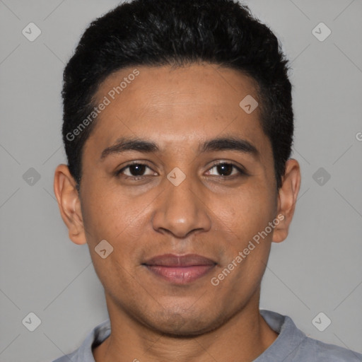 Joyful latino young-adult male with short  black hair and brown eyes