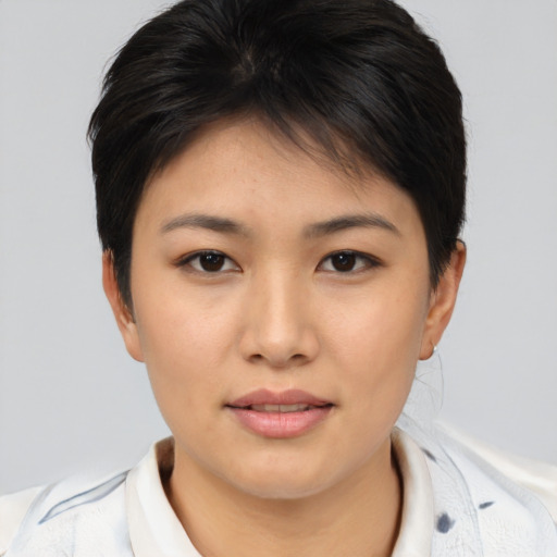 Joyful asian young-adult female with short  brown hair and brown eyes