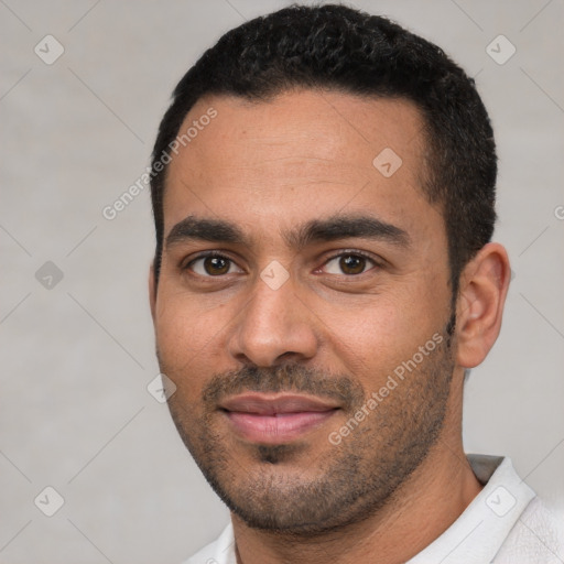 Joyful white young-adult male with short  black hair and brown eyes