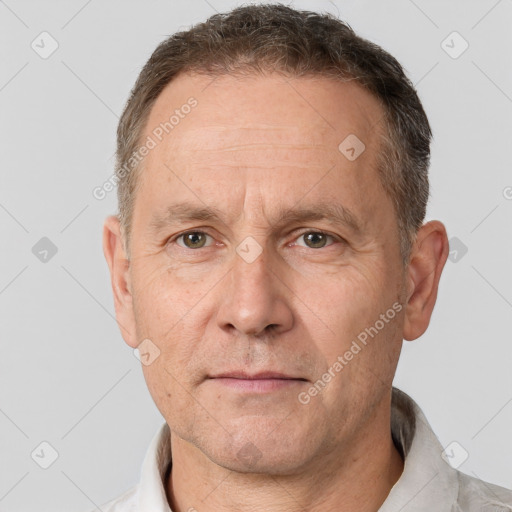 Neutral white middle-aged male with short  brown hair and brown eyes