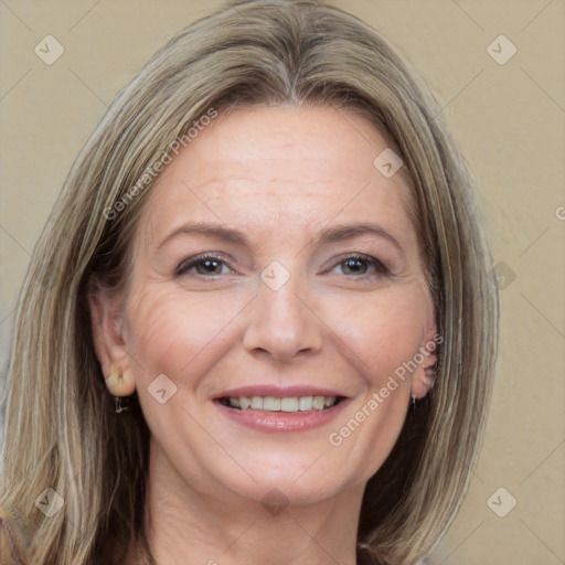 Joyful white adult female with medium  brown hair and grey eyes