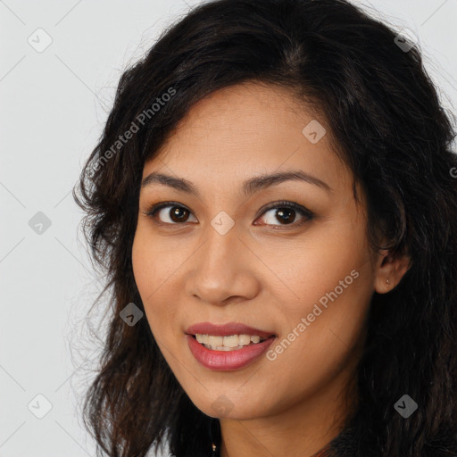 Joyful latino young-adult female with long  brown hair and brown eyes