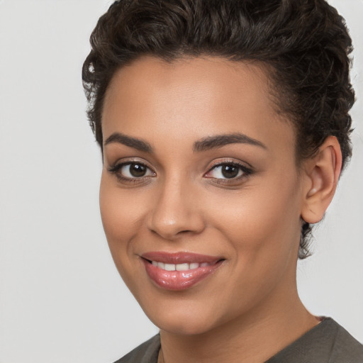 Joyful white young-adult female with short  brown hair and brown eyes