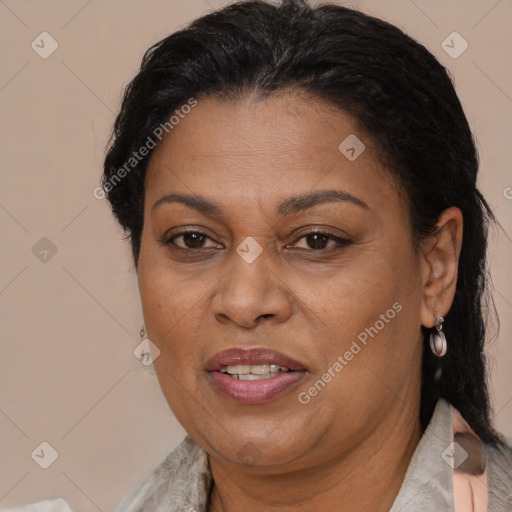 Joyful latino adult female with medium  brown hair and brown eyes