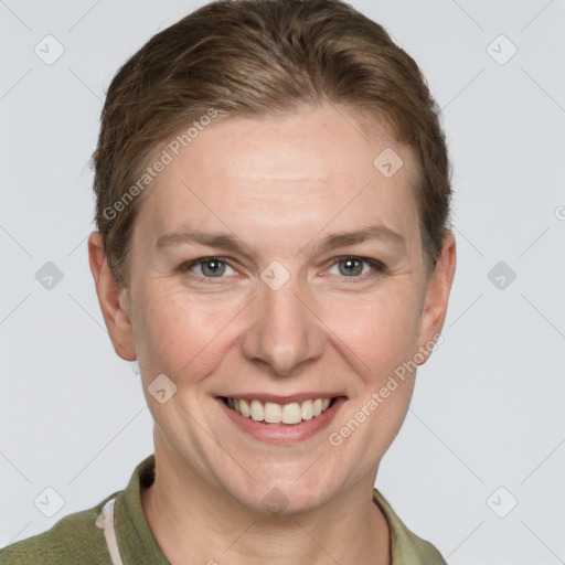 Joyful white adult female with short  brown hair and grey eyes