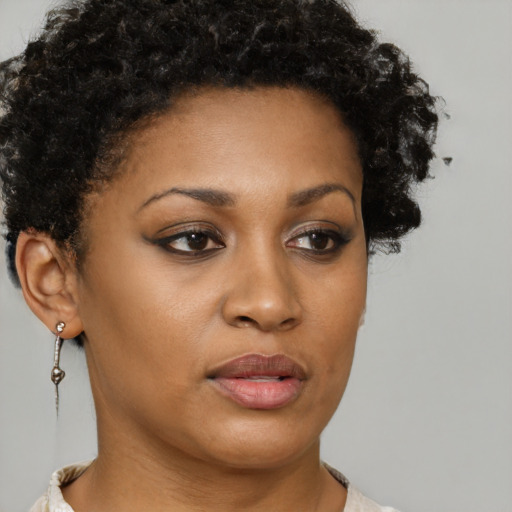 Neutral black young-adult female with short  brown hair and brown eyes