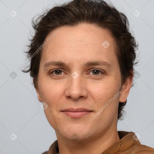 Joyful white adult female with short  brown hair and brown eyes