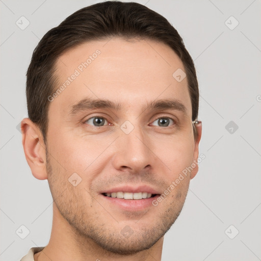 Joyful white young-adult male with short  brown hair and grey eyes