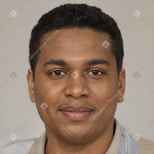 Joyful black young-adult male with short  black hair and brown eyes