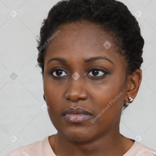 Neutral black young-adult female with short  brown hair and brown eyes