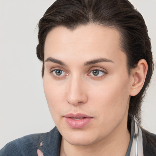 Neutral white young-adult female with medium  brown hair and brown eyes