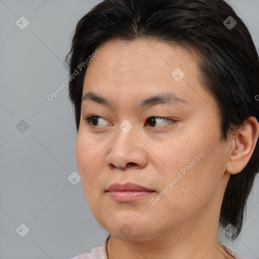 Joyful asian young-adult female with medium  brown hair and brown eyes