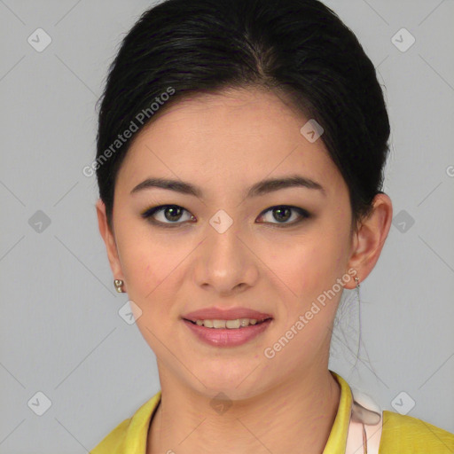 Joyful asian young-adult female with short  black hair and brown eyes