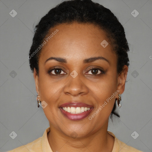 Joyful black young-adult female with short  black hair and brown eyes