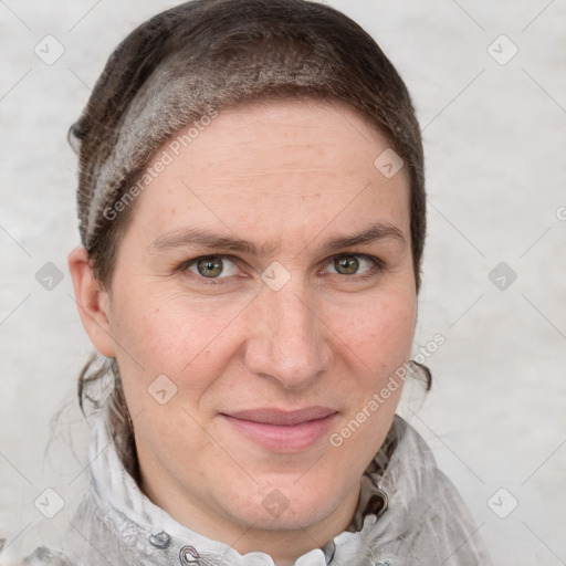 Joyful white adult female with short  brown hair and grey eyes